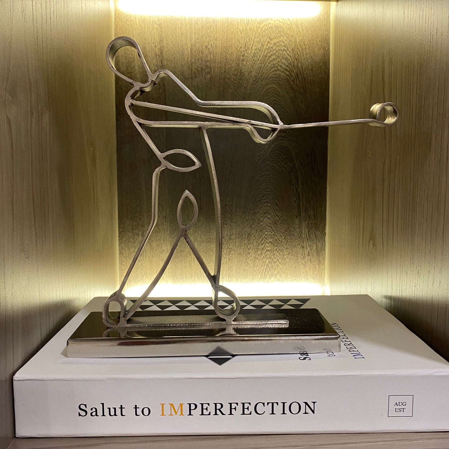 Image of Andrew in Silver metal sculpture from august.org.in on top of coffee table book box