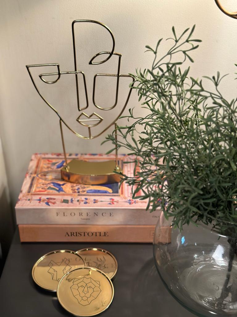 Image of Gilded Beasts coasters from august.org.in with coffee table book box and sculpture and vase