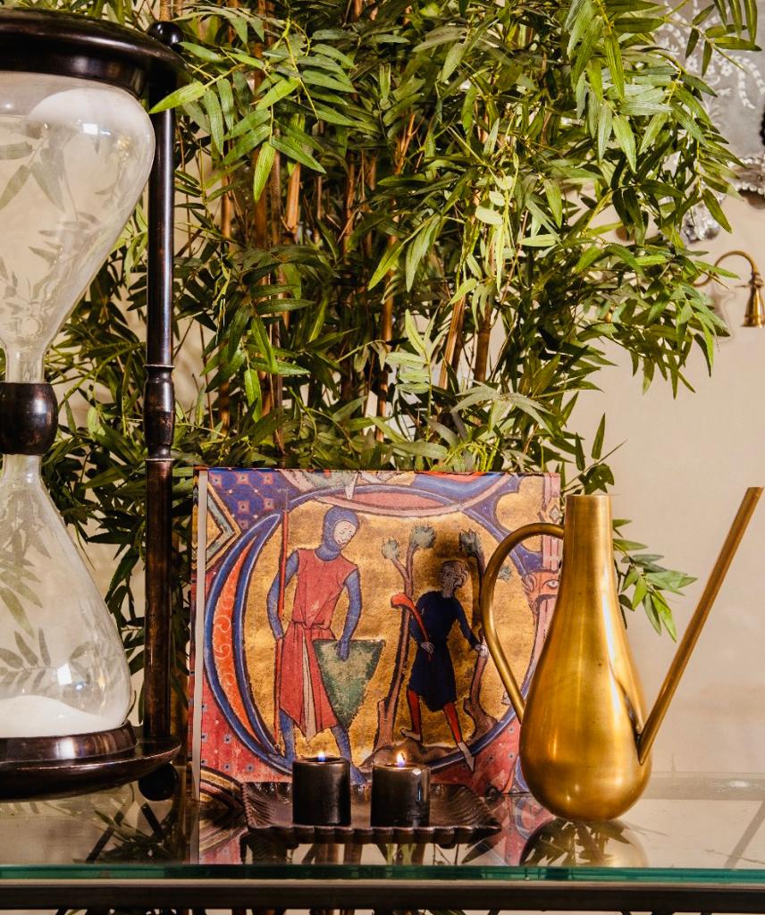 Image of David & Goliath coffee table book box from august.org.in with metal jug and candles