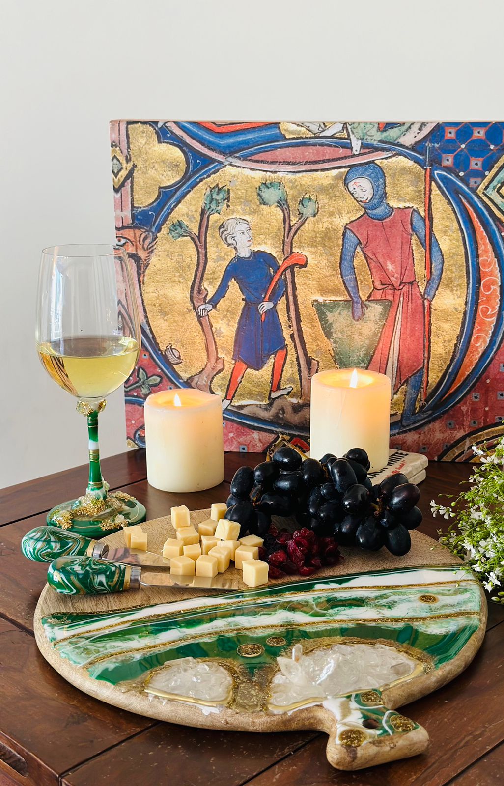 Round Cheese resin board green with candles and wine glass in background