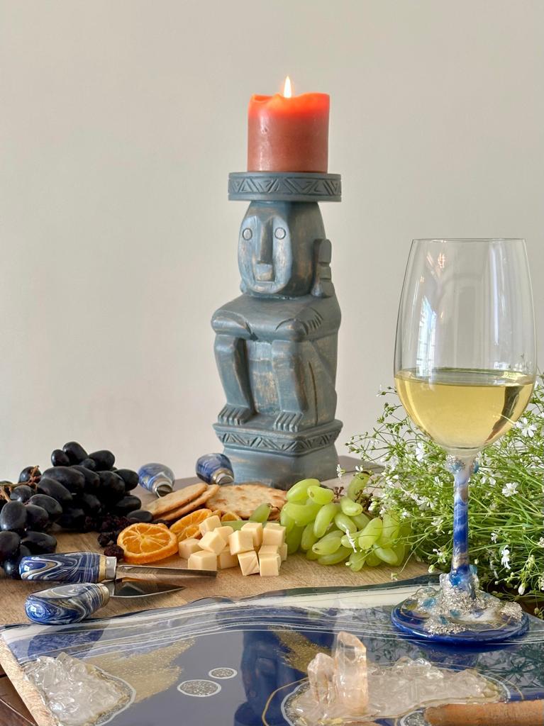 Cheese knives Blue with wine glass and candle and food