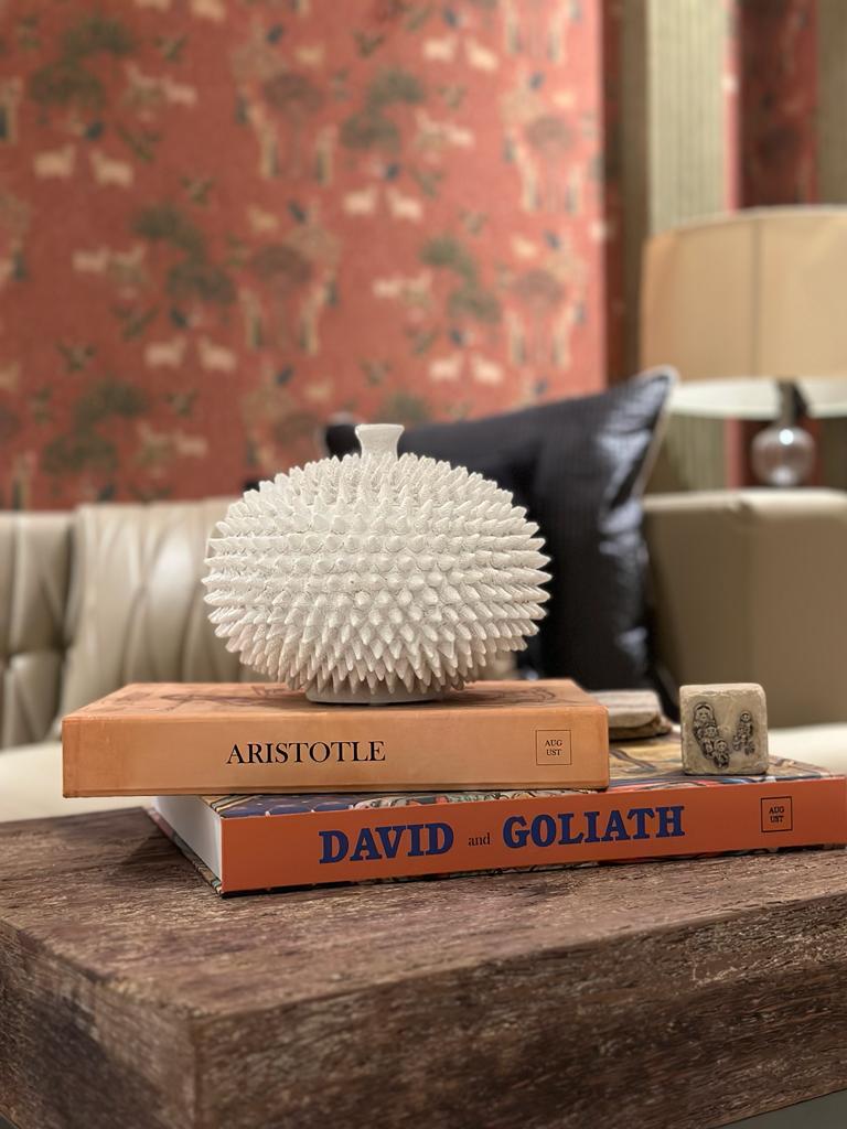 Alabaster porcupine wooden box on top of coffee table book boxes