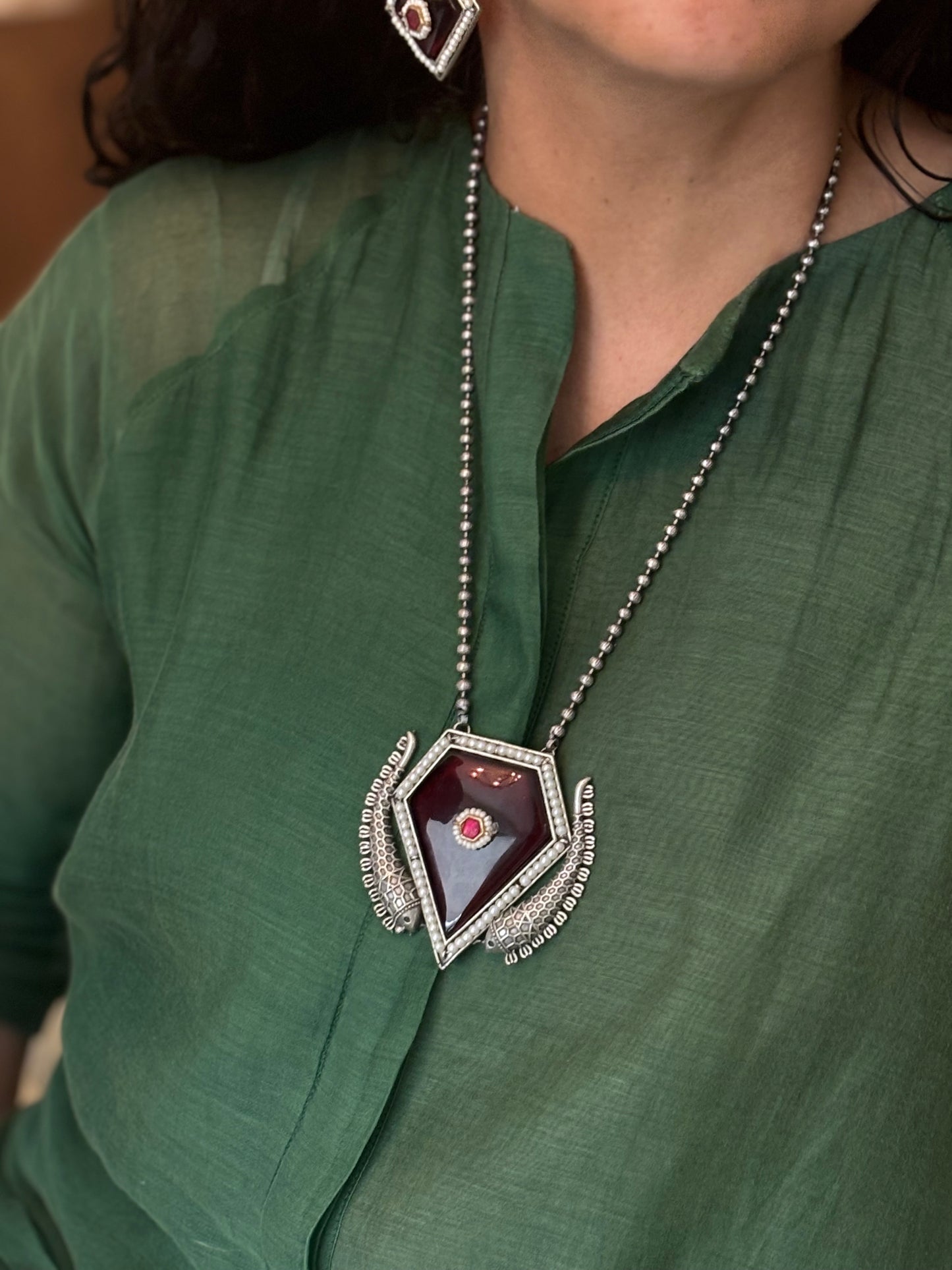 Manika pendent on metal beads string