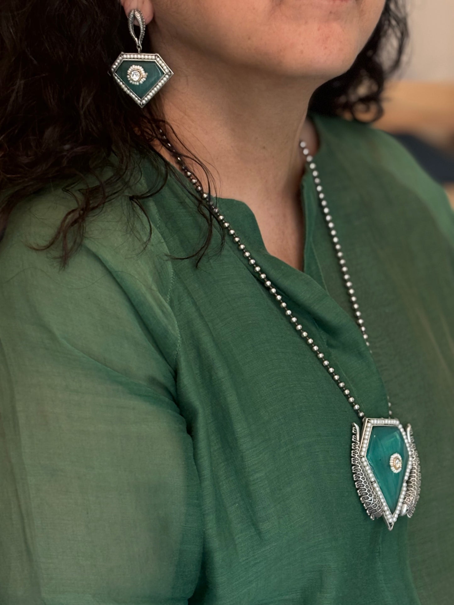 Farzeen pendant on metal beads chain