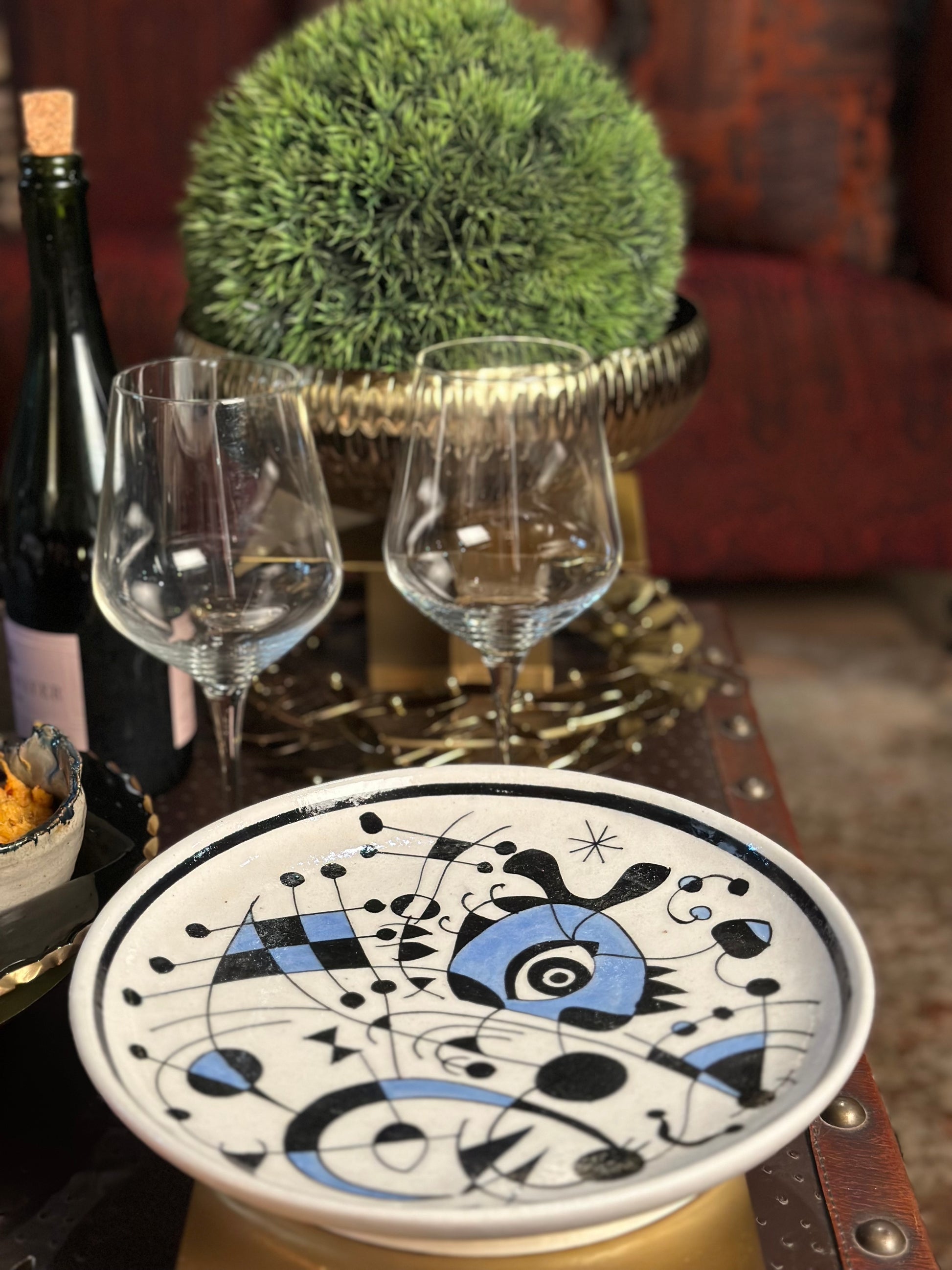 Image of celebrating miro Stoneware Platter from august.org.in on a table with glasses and bottle of wine 