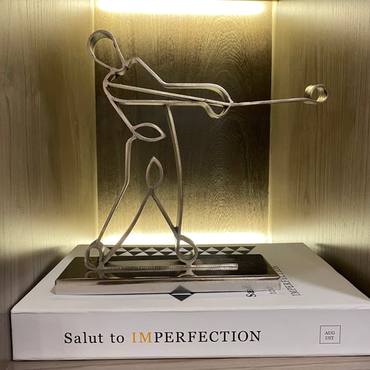 Image of Andrew in Silver metal sculpture from august.org.in on top of coffee table book box