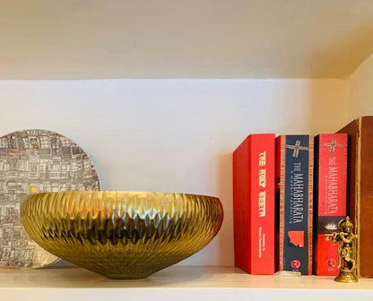 Image of Bakuli metal bowl from august.org.in with books 