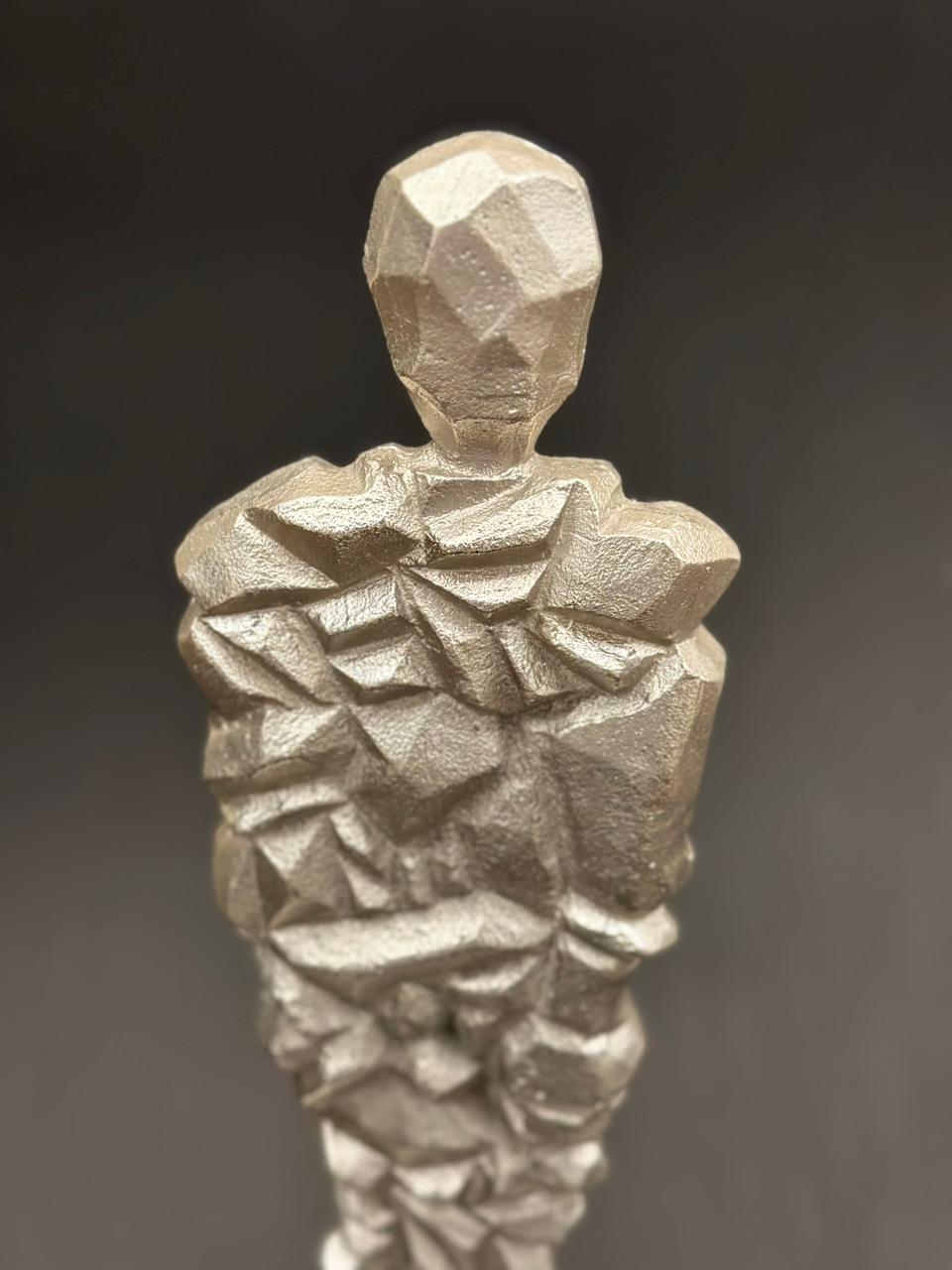 Image of Cleo (in silver) sculpture from august.org.in