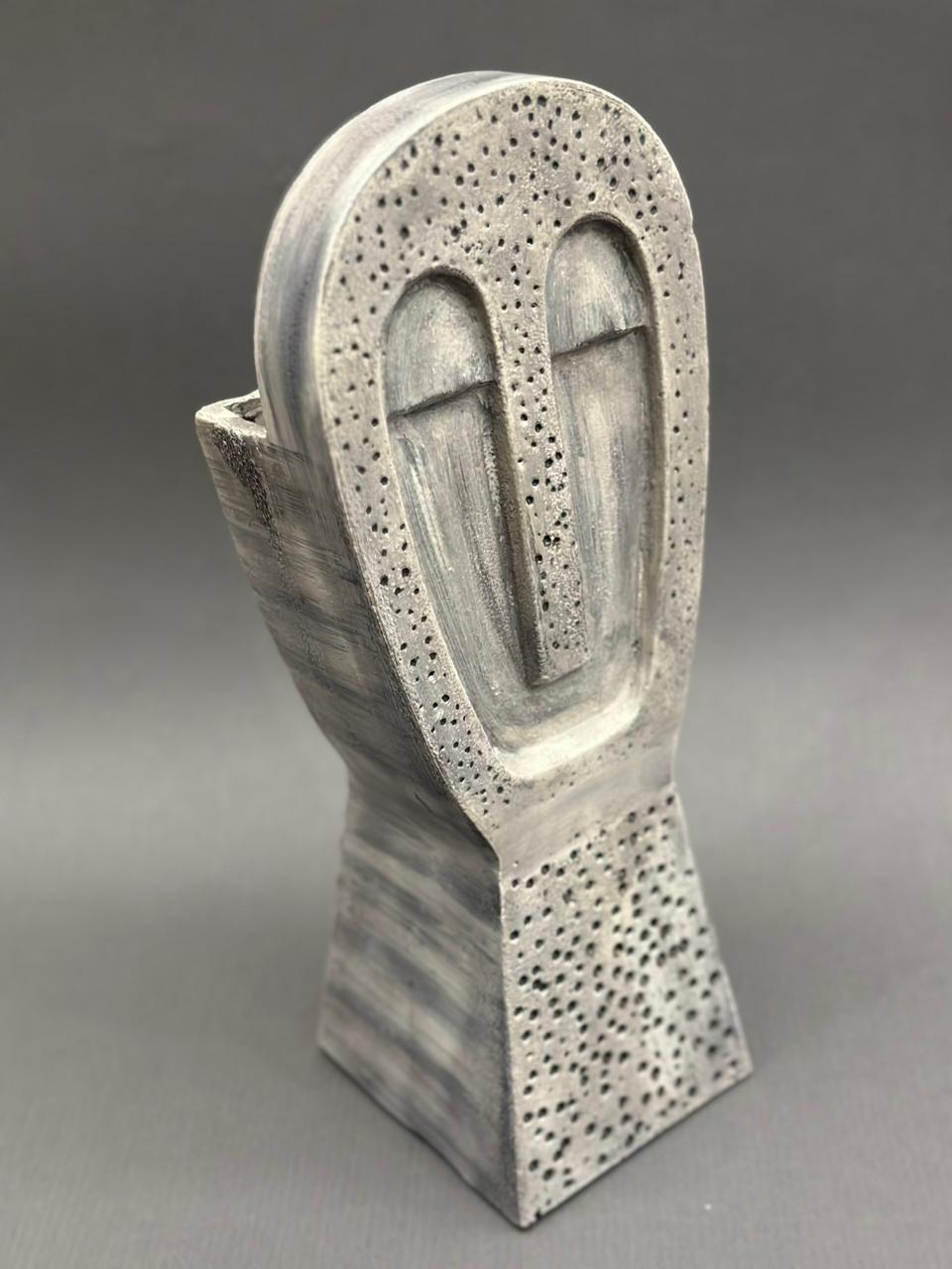 Image of Agantuk in Pewter sculpture from august.org.in.