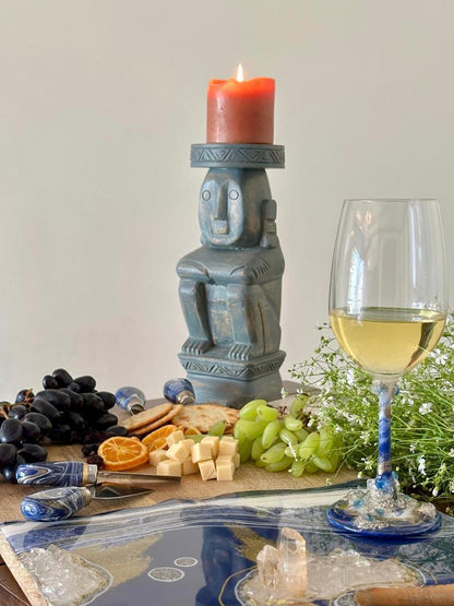 Cheese knives Blue with wine glass and candle and food 